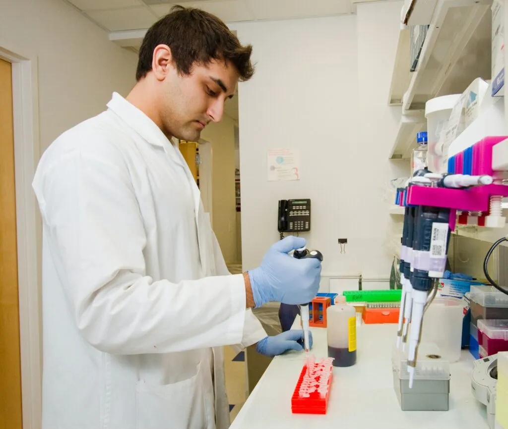 Researcher working at a laboratory bench.