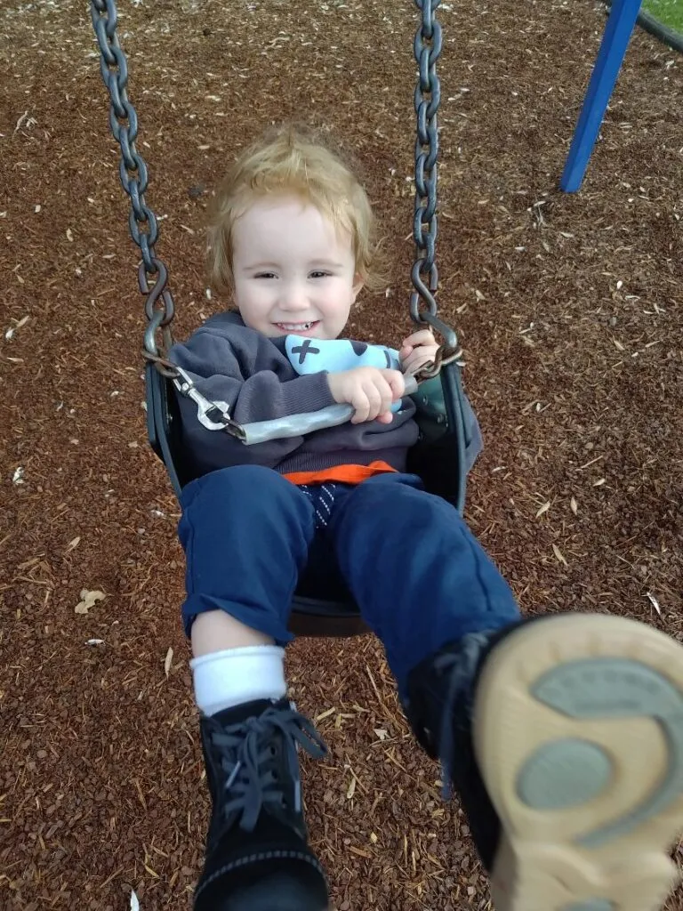 Austin, who lives with STXBP1, smiling.