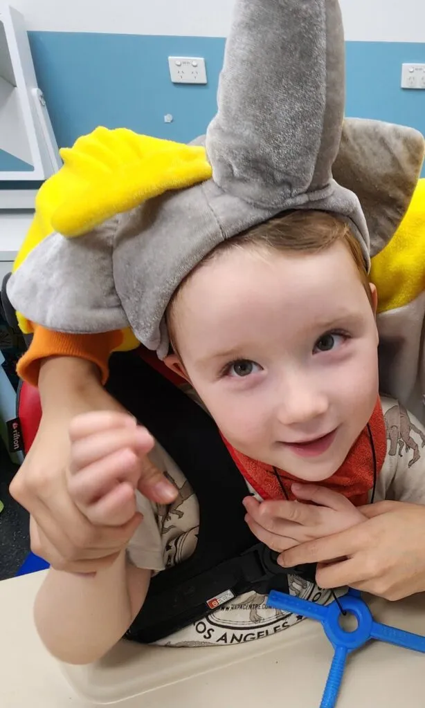 Caleb, who lives with STXBP1, smiling.