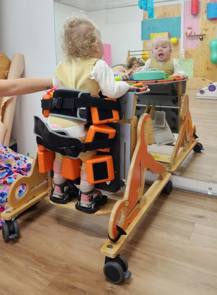 A child living with STXBP1 supported by their family.