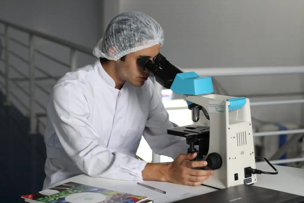 Close-up of laboratory pipettes and sample trays used in gene therapy research.